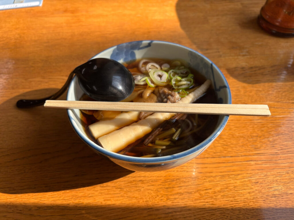 Bowl of hot sansai soba (mountain vegetable noodles) at Kimenen, the soba restaurant inside Sukayu Onsen.