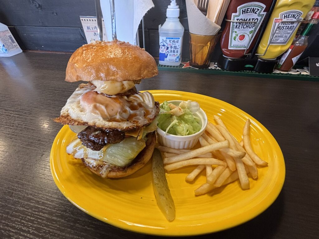 A hearty teriyaki chicken burger with teriyaki sauce, mayonnaise, and a fried egg.