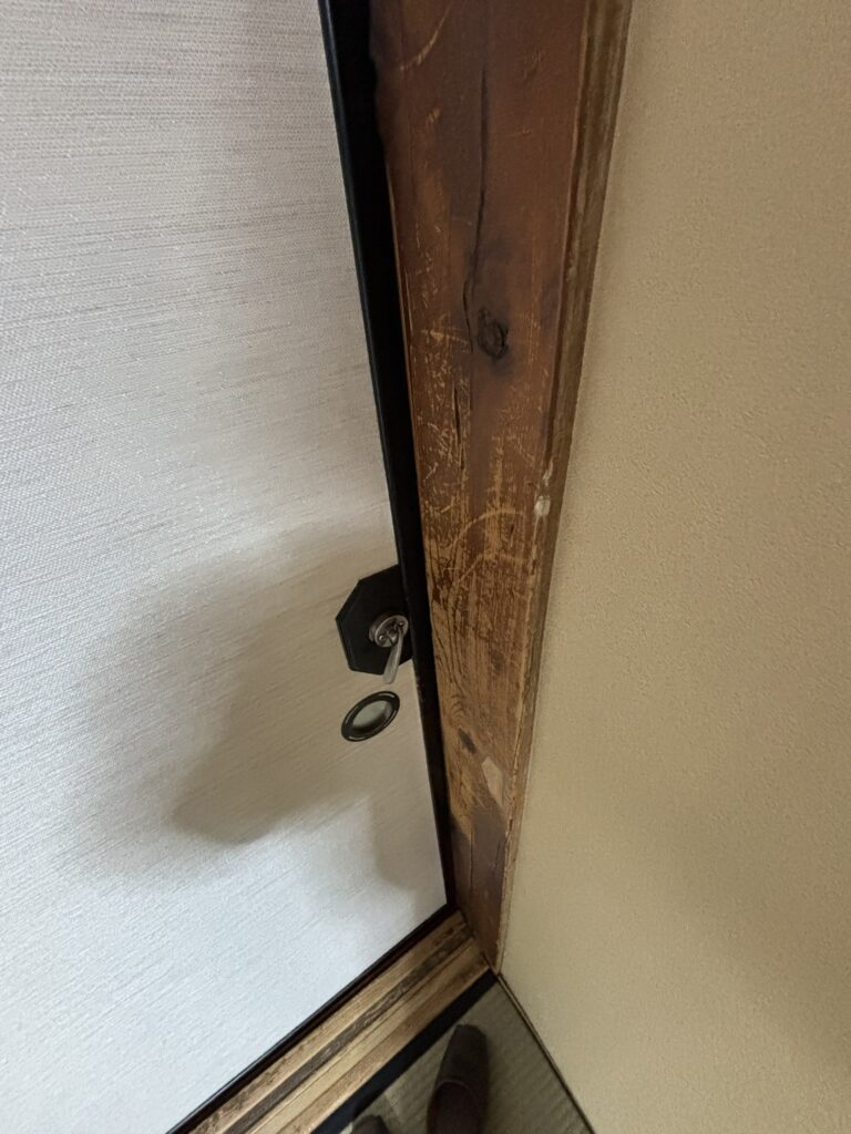 A simple key on a sliding door in a traditional tatami room at Sukayu Onsen.